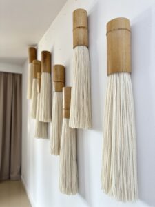 Handcrafted bamboo and wool fiber art wall module detail, natural materials