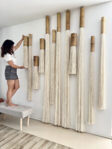 large scale fiber art wall installation in modern hotel interior