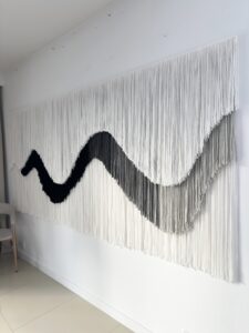 Custom fiber art wall installation in modern interior