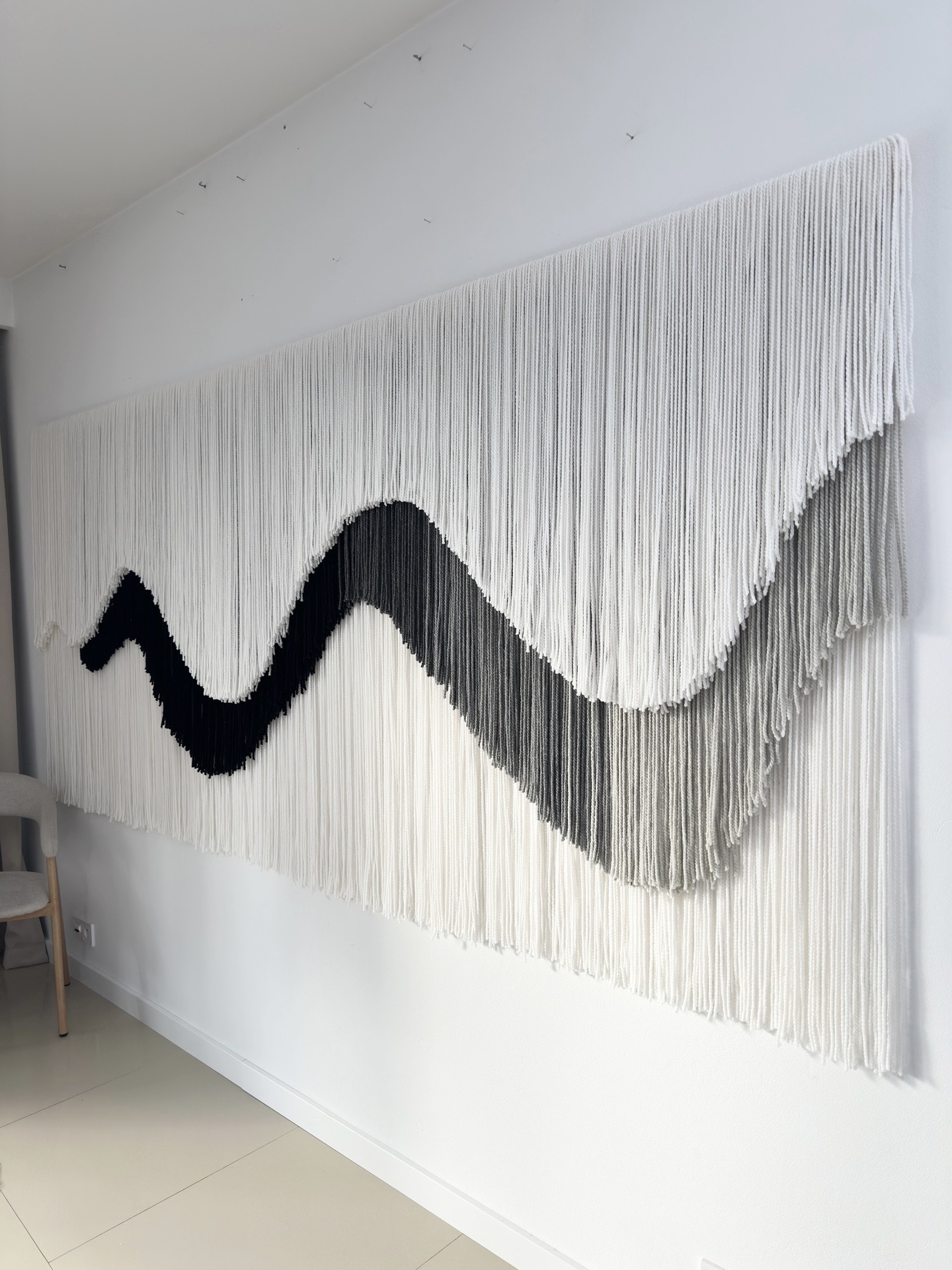 Custom fiber art wall installation in modern interior